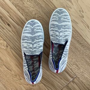 These Rothys sneakers look and feel brand new. Machine washable.